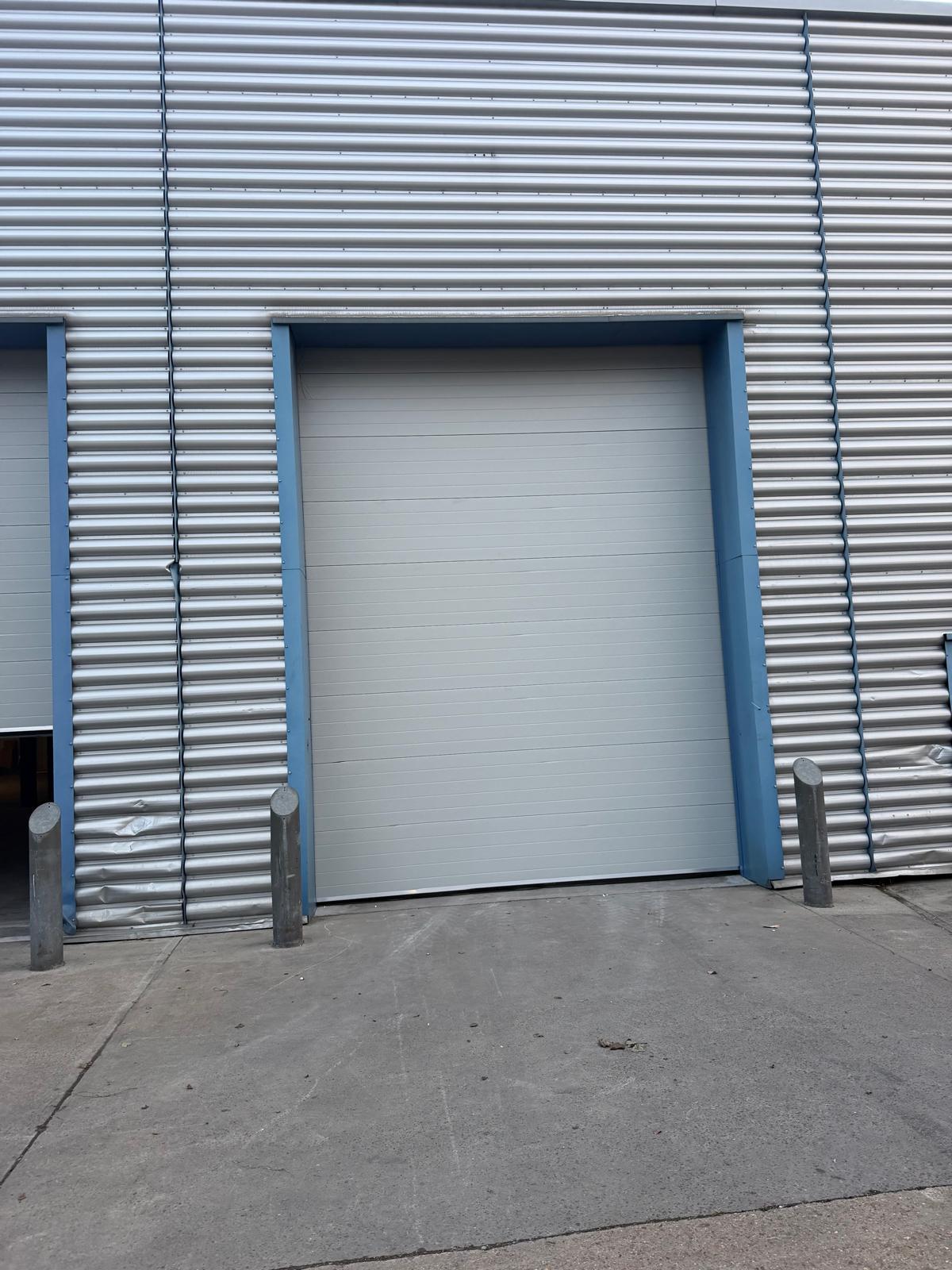 Detail of two sectional doors and their guide framing